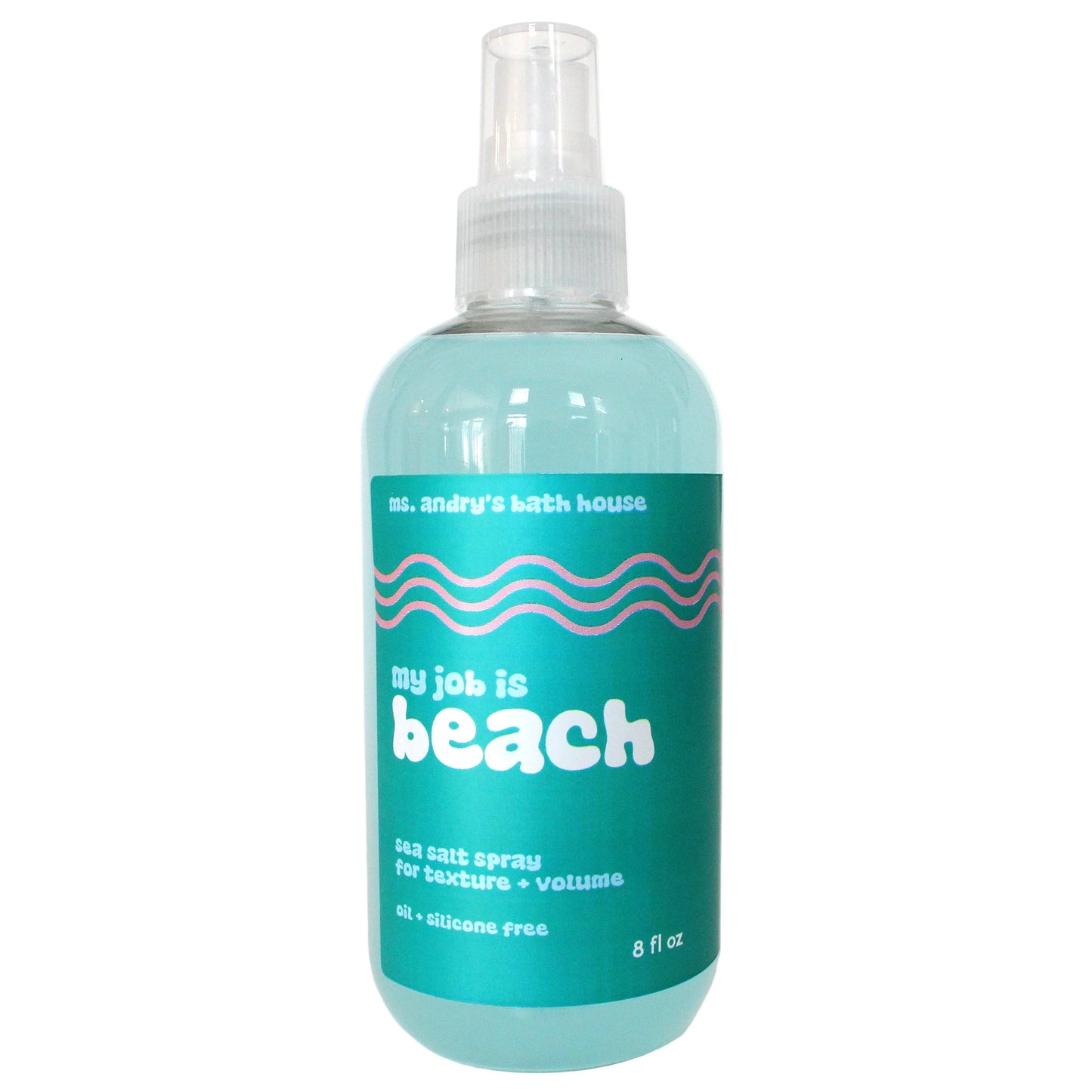 Bottle of 'my job is beach' sea salt spray with a white label on a white background