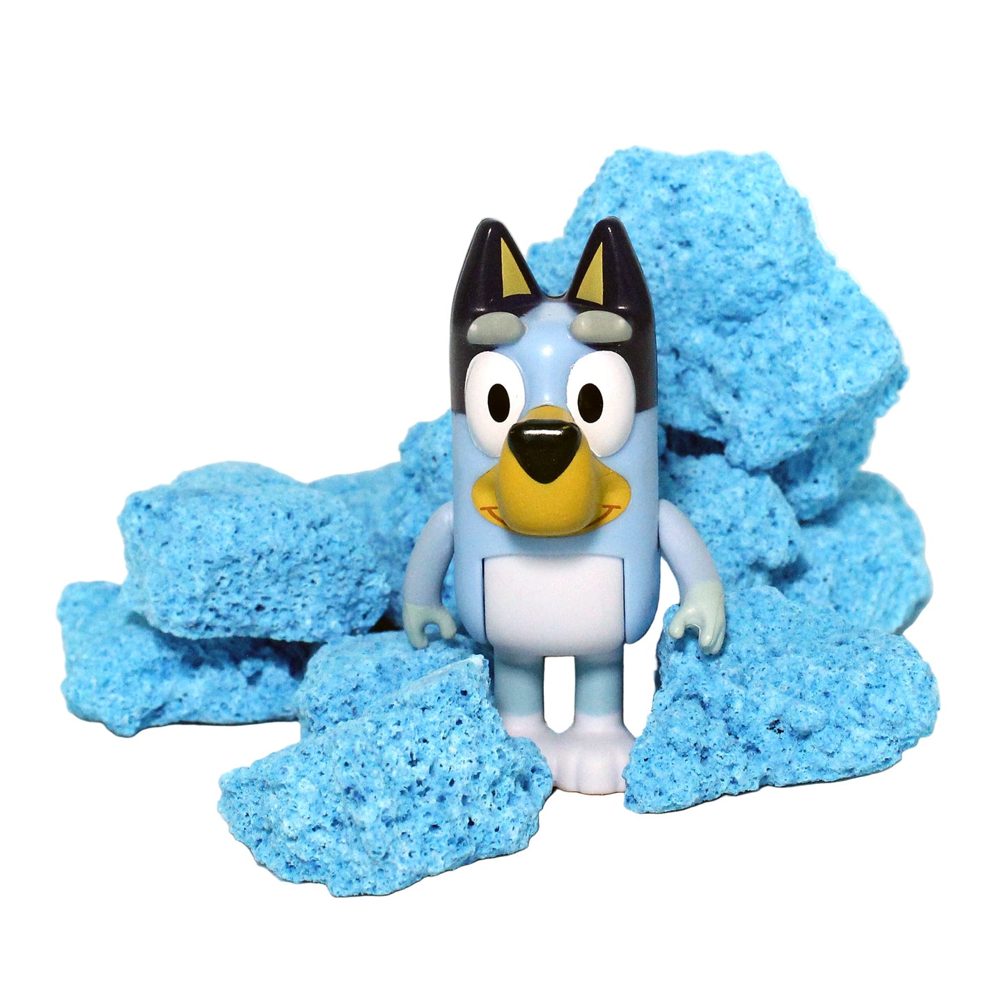 Bluey figurine next to blue bath bomb crumble