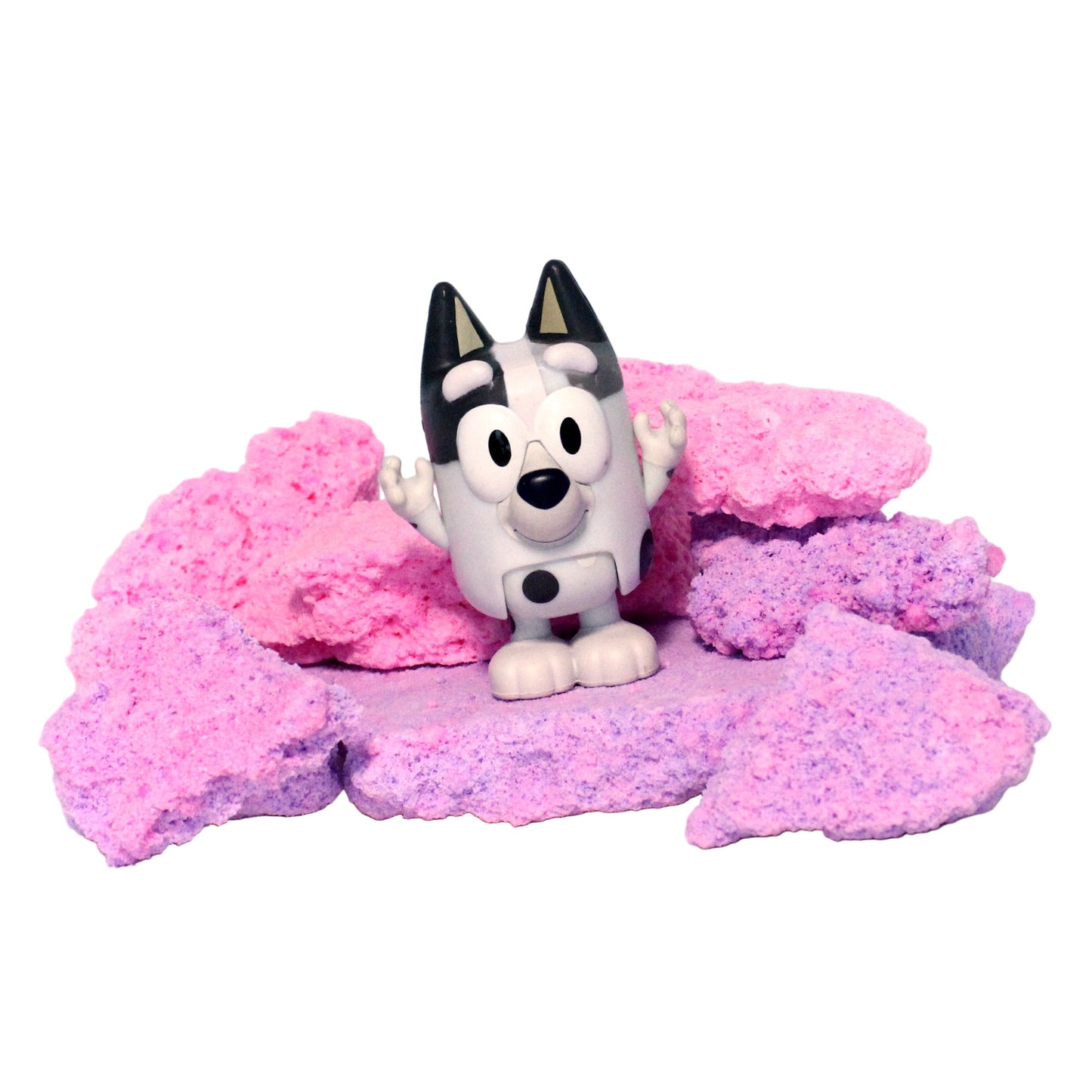 Toy figure of a dog on pink foam with a white background